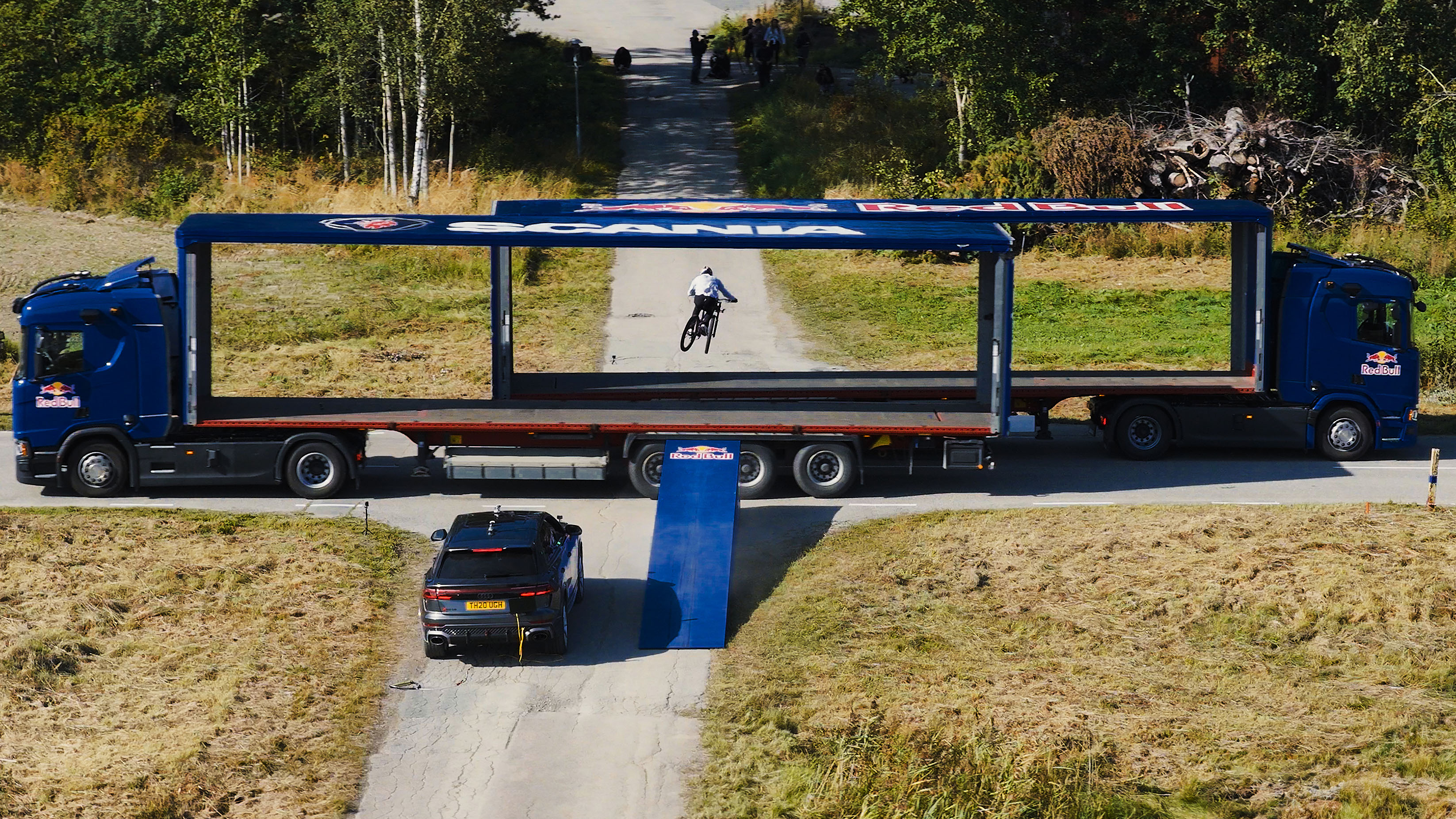 Red Bull Scania moving trucks stunt bike jump