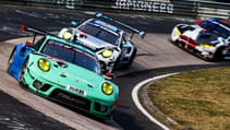 Cars racing at Karussell corner