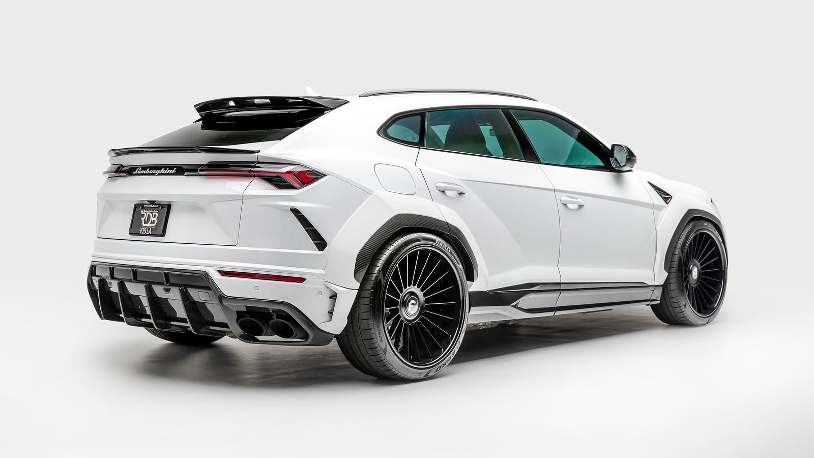 1016-industries-lamborghini-urus-widebody-white-side-rear.jpg