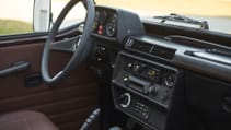 expedition-motor-company-rubellite-red-wolf-side-view-dash-day-time.jpg