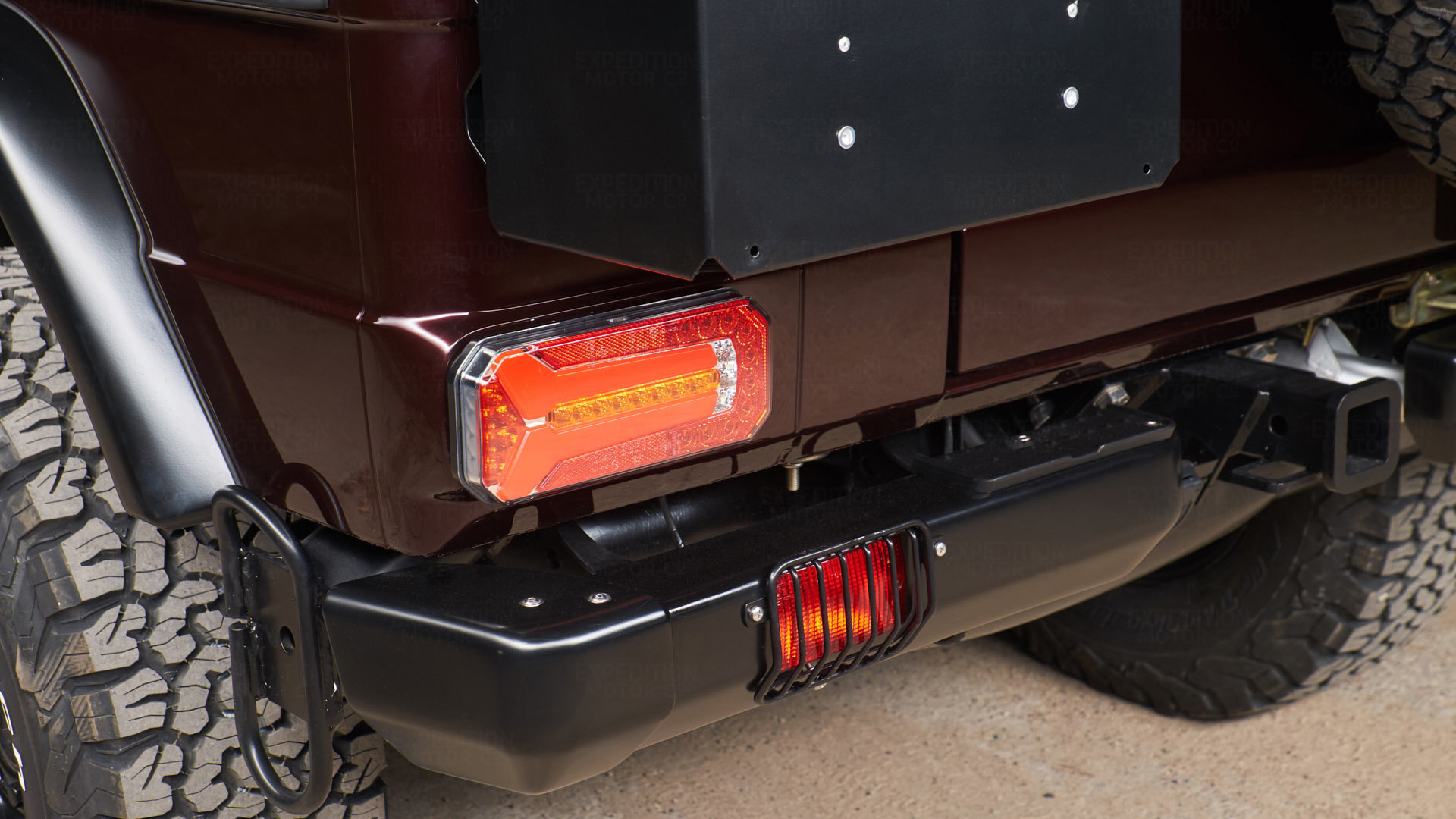 expedition-motor-company-rubellite-red-wolf-tail-light-close-up-night-time.jpg