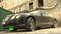 Only in Russia: Bentley supercar caked in concrete in Moscow