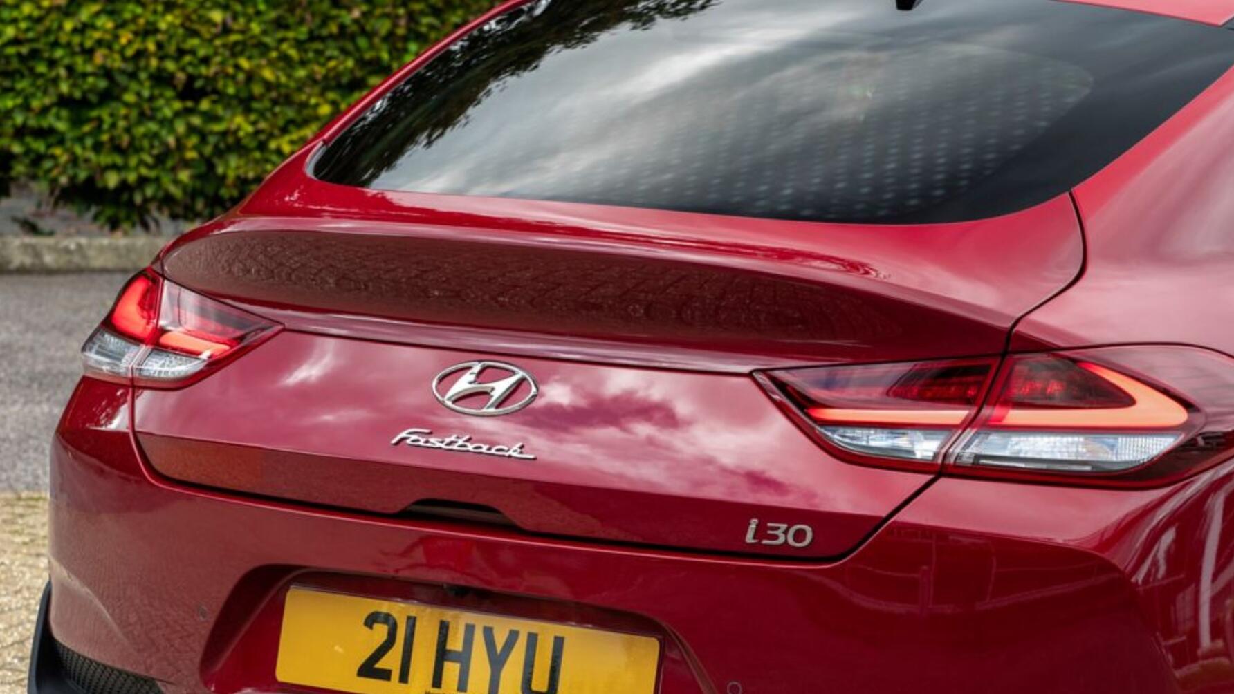 Static close-up of rear of red Hyundai i30 Fastback